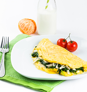 Farm Stand Omelet made with Astro Yogurt served with cherry tomatoes on the side