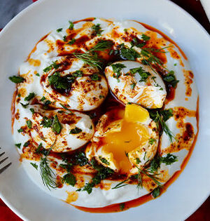 Cibir Spiced Eggs with Astro Yogurt on a white serving plate.